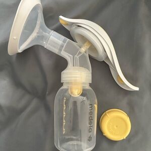 Medela Manual Breast Pump with Yellow Accents